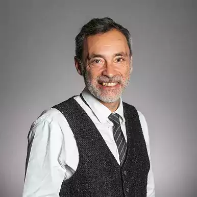 Gabor Betegh headshot wearing tie and black waistcoat